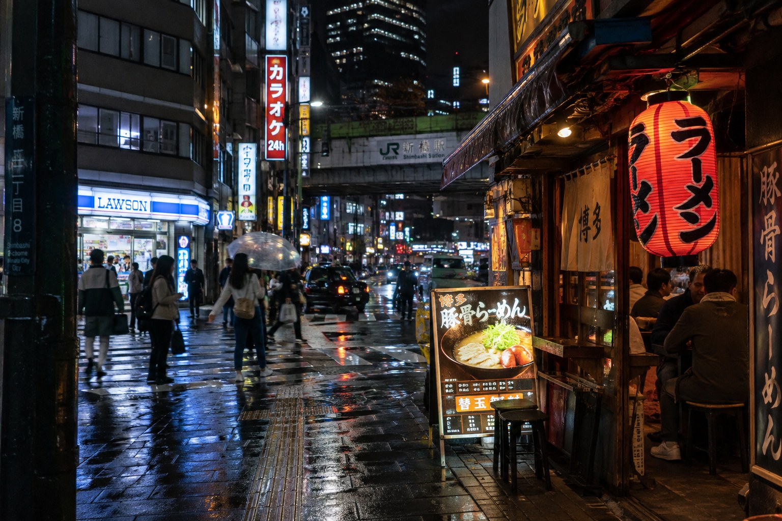 Tokyo street at night with ramen, convenience store lights and wet pavement